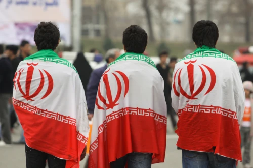 Iranian youths carry Iran flag